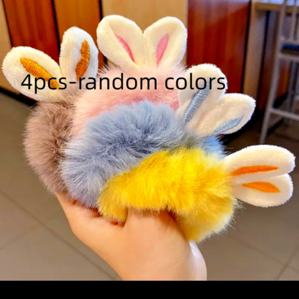 - NEW hair ties with bunny ears. (4 @ 9.00 Each)